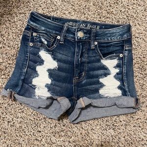 AMERICAN EAGLE Next Level Stretch Dark Distressed Denim Hi-Rise Shortie Shorts